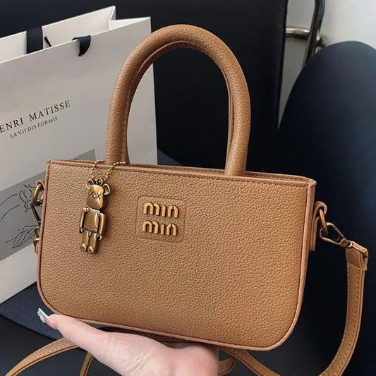Nouveau sac carré tendance 2025 pour femme, petit sac de luxe minimaliste à porter à l’épaule pour téléphone المحمول, pochette bandoulière mode pour fille.