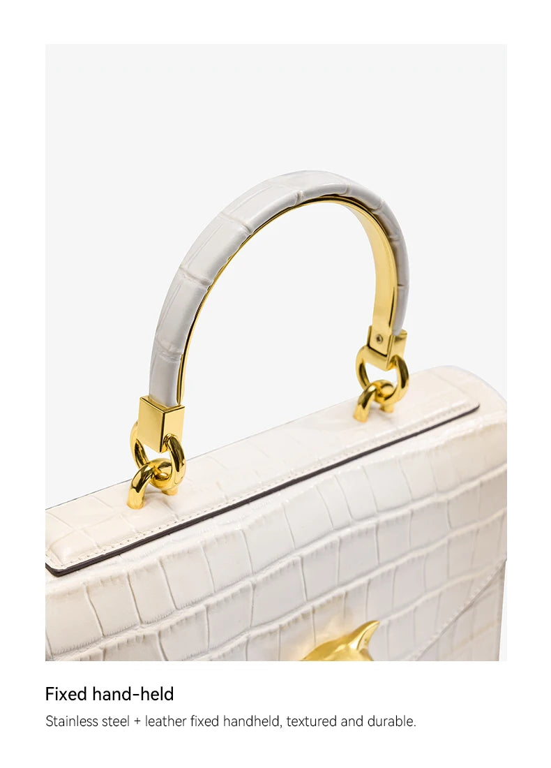 Le sac à main en cuir véritable BAFELLI au motif crocodile tendance est doté d’une bandoulière amovible en cuir de vache, adaptée au port à la main.